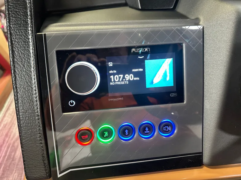 Slide: The Image of 2025 Tahoe Grand Tahoe 2585 Tritoon audio system display showing 107.9 MHz station. - 16