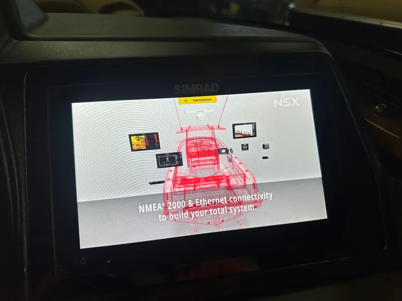Slide: The Image of Simrad display showing NMEA 2000 and Ethernet connectivity on 2025 Tahoe Grand Tahoe Tritoon. - 18