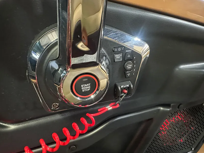 Slide: The Image of 2025 Tahoe Grand Tahoe 2585 Tritoon control panel with start-stop button and throttle controls. - 19