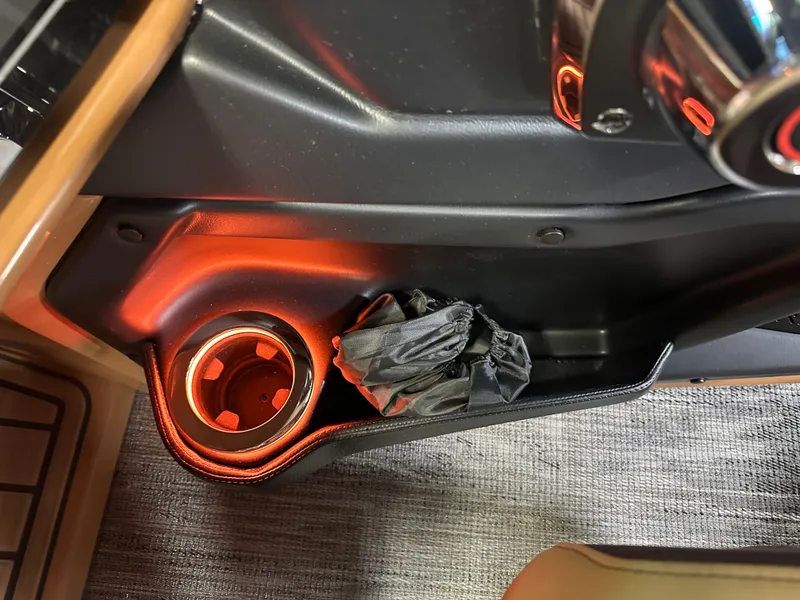 Slide: The Image of Illuminated cup holder in 2025 Tahoe Grand Tahoe 2585 Tritoon boat interior. - 20