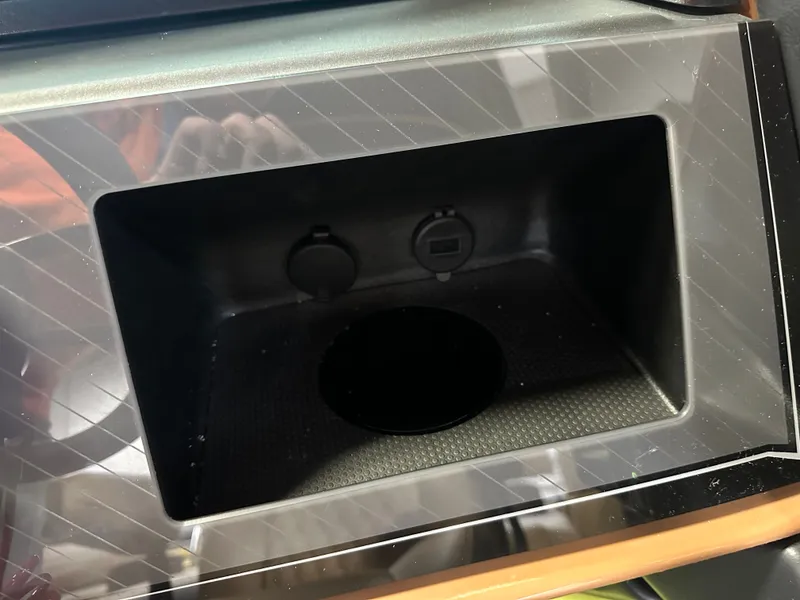 Slide: The Image of Storage compartment in 2025 Tahoe Grand Tahoe 2585 Quad Lounge Tritoon boat. - 22