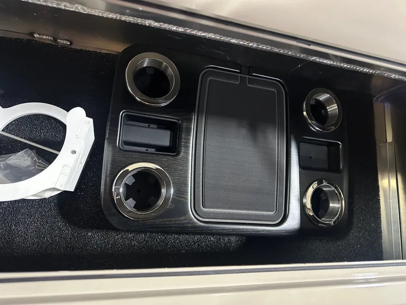 Slide: The Image of Interior console of 2025 Tahoe Grand Tahoe 2585 Tritoon with cup holders and storage compartments. - 27