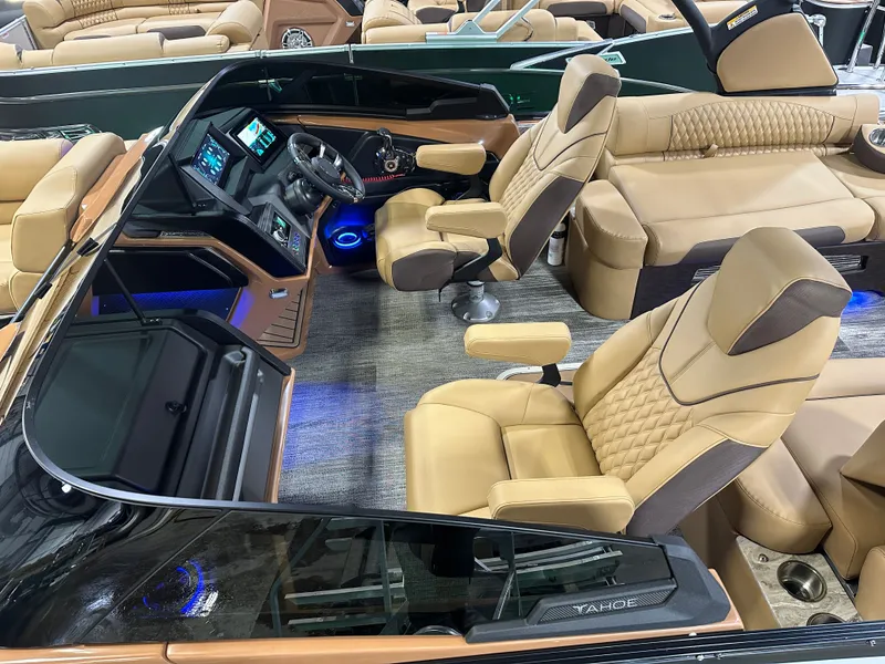 Slide: The Image of Luxurious 2025 Tahoe Grand Tahoe 2585 Tritoon interior with plush seating and modern dashboard. - 3
