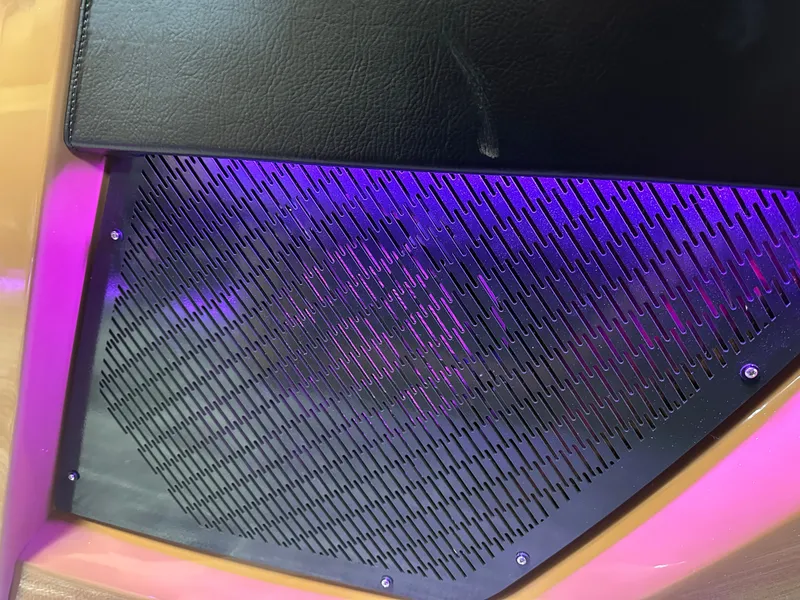 Slide: The Image of Close-up of 2025 Tahoe Grand Tahoe 2585 Tritoon's stylish grille with purple lighting. - 40