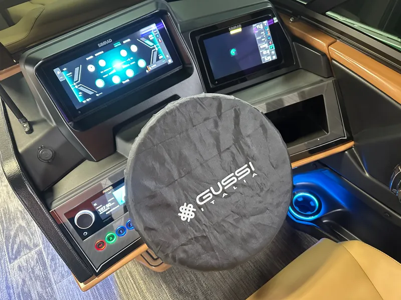 Slide: The Image of Dashboard of 2025 Tahoe Grand Tahoe 2585 Tritoon with advanced controls and Gussi Italia steering. - 46