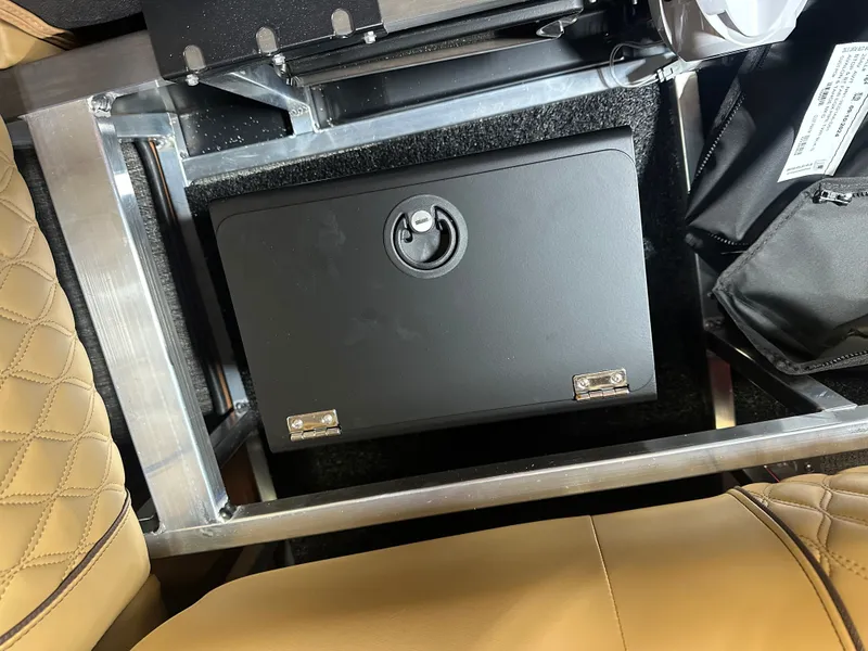 Slide: The Image of Secure storage compartment in 2025 Tahoe Grand Tahoe 2585 Quad Lounge Tritoon boat. - 48