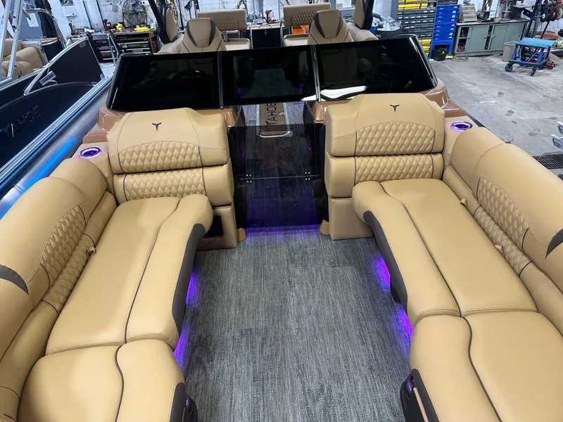 Slide: The Image of Luxurious interior of 2025 Tahoe Grand Tahoe 2585 Tritoon with plush seating and ambient lighting. - 7