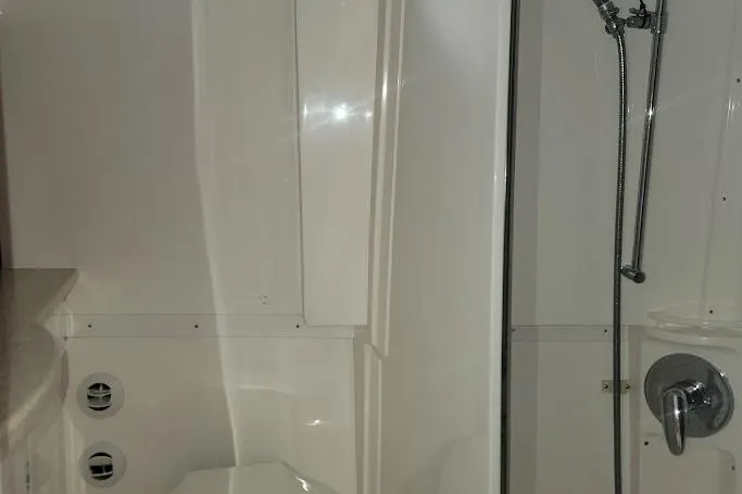 Slide: The Image of Bathroom interior of 2010 Intrepid 39 Kevlar Hull Sport Yacht, featuring shower and fixtures. - 10