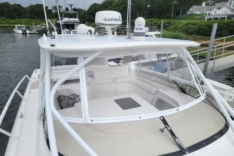 Slide: The Image of 2010 Intrepid 39 Kevlar Hull Sport Yacht docked, featuring Garmin and FLIR equipment. - 12