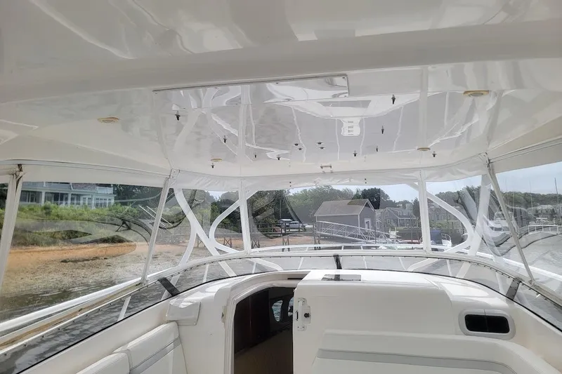 Slide: The Image of Interior view of 2010 Intrepid 39 Kevlar Hull sport yacht, showcasing helm and seating area. - 19