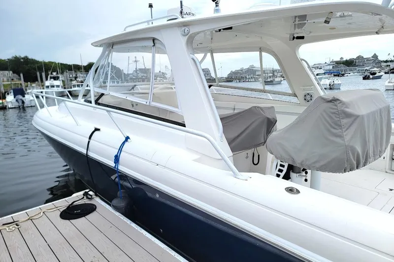 Slide: The Image of 2010 Intrepid 39 Kevlar Hull Sport Yacht docked at marina. - 21