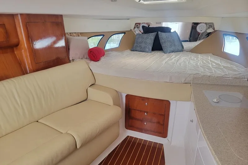 Slide: The Image of Interior of 2010 Intrepid 39 Kevlar Hull yacht with cozy bed and seating area. - 24