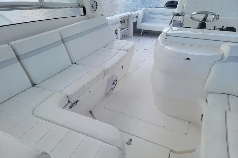 Slide: The Image of Luxurious white interior of 2010 Intrepid 39 Kevlar Hull sport yacht, featuring spacious seating. - 27