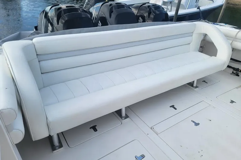 Slide: The Image of White seating on 2010 Intrepid 39 Kevlar Hull sport yacht, with visible outboard motors. - 29
