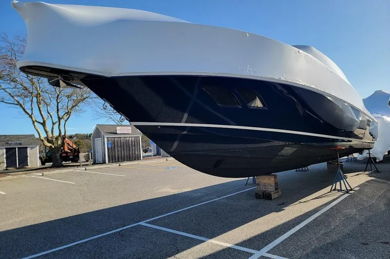 Slide: The Image of 2010 Intrepid 39 Kevlar Hull Sport Yacht on stands in a parking lot. - 43
