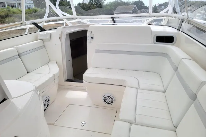Slide: The Image of Luxurious white seating area on a 2010 Intrepid 39 Kevlar Hull sport yacht. - 6