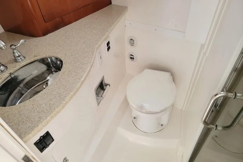 Slide: The Image of 2010 Intrepid 39 Kevlar Hull yacht bathroom with sink and toilet. - 9