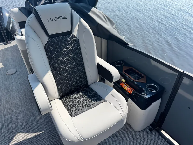 Slide: The Image of 2024 Harris 250 Grand Mariner boat seat with elegant design and cup holders. - 15