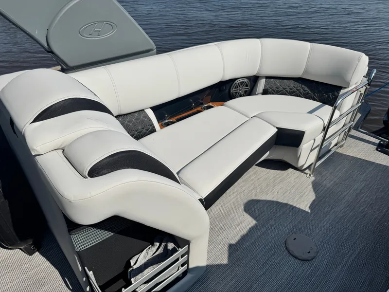 Slide: The Image of Luxurious seating on 2024 Harris 250 Grand Mariner pontoon boat, featuring elegant white upholstery. - 16