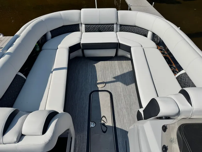Slide: The Image of 2024 Harris 250 Grand Mariner boat interior with luxurious seating and modern design. - 4