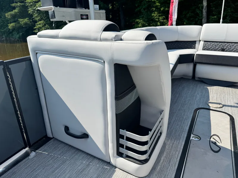 Slide: The Image of 2024 Harris 250 Grand Mariner interior with sleek seating and storage, featuring modern design elements. - 8