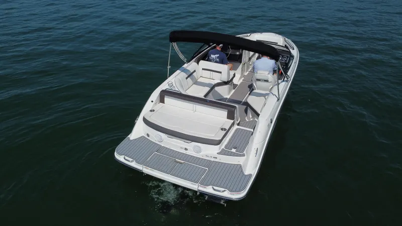 Slide: The Image of 2017 Sea Ray SLX 230 boat cruising on open water, rear view. - 7