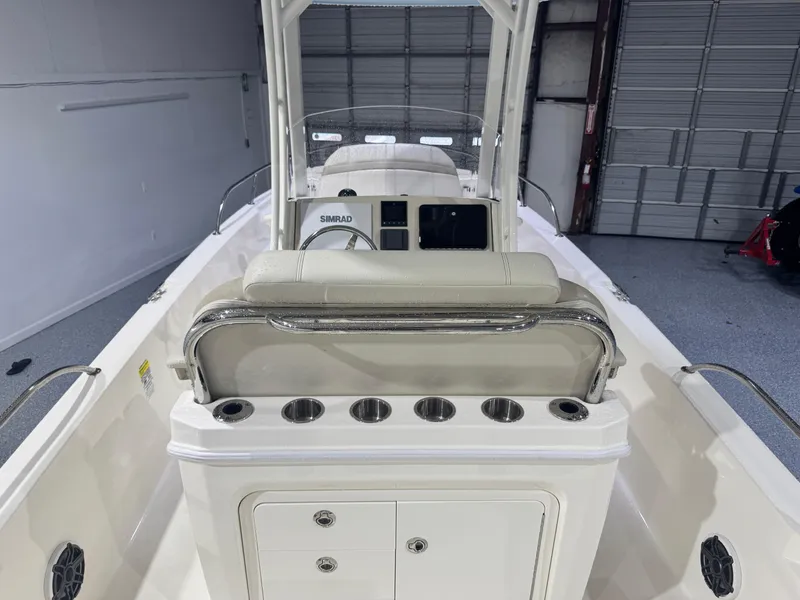Slide: The Image of 2024 Boston Whaler 250 Dauntless boat interior with console and seating. - 24