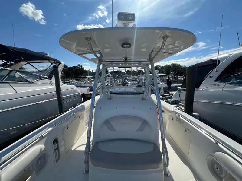 Slide: The Image of 2005 Boston Whaler 320 Outrage boat docked under clear blue sky. - 18