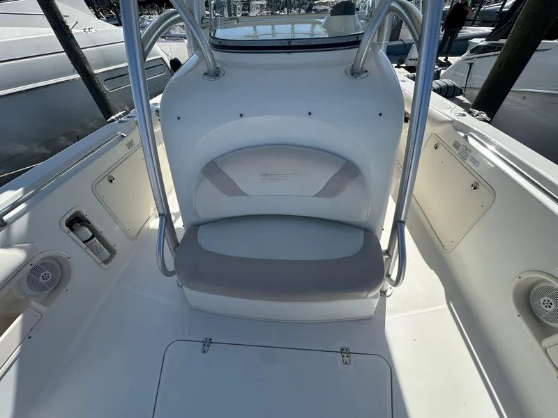 Slide: The Image of 2005 Boston Whaler 320 Outrage boat interior with seating and storage compartments. - 19