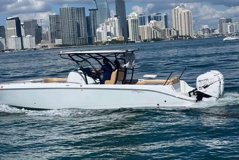 Slide: The Image of 2002 Baja 340 Islander Outboard on trailer, featuring twin Mercury engines. - 15