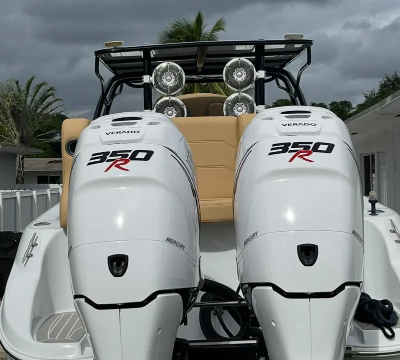 Slide: The Image of 2002 Baja 340 Islander Outboard boat on trailer at boat ramp, sunny day. - 3