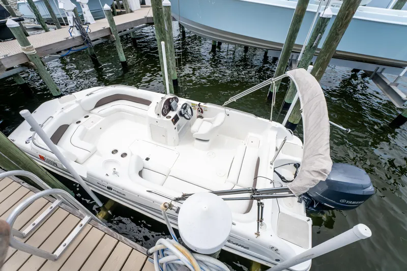 Slide: The Image of 2013 Hurricane SunDeck Sport 201 OB boat docked at marina, overhead view. - 12