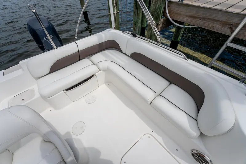 Slide: The Image of 2013 Hurricane SunDeck Sport 201 OB boat interior with white seating and water view. - 18