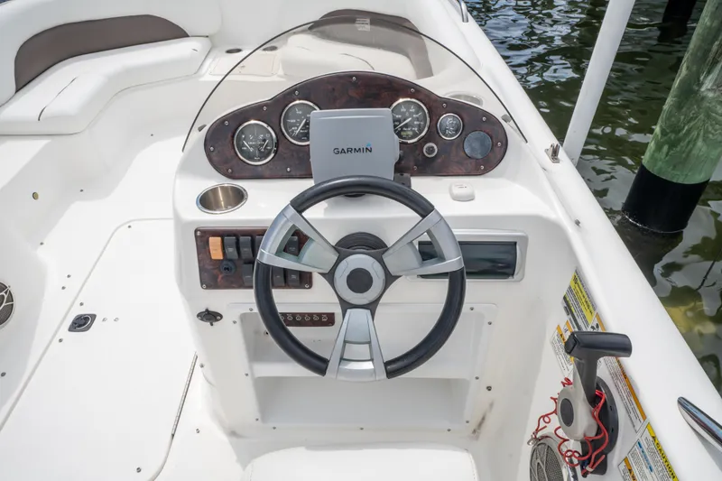 Slide: The Image of 2013 Hurricane SunDeck Sport 201 OB boat dashboard with Garmin navigation system. - 21