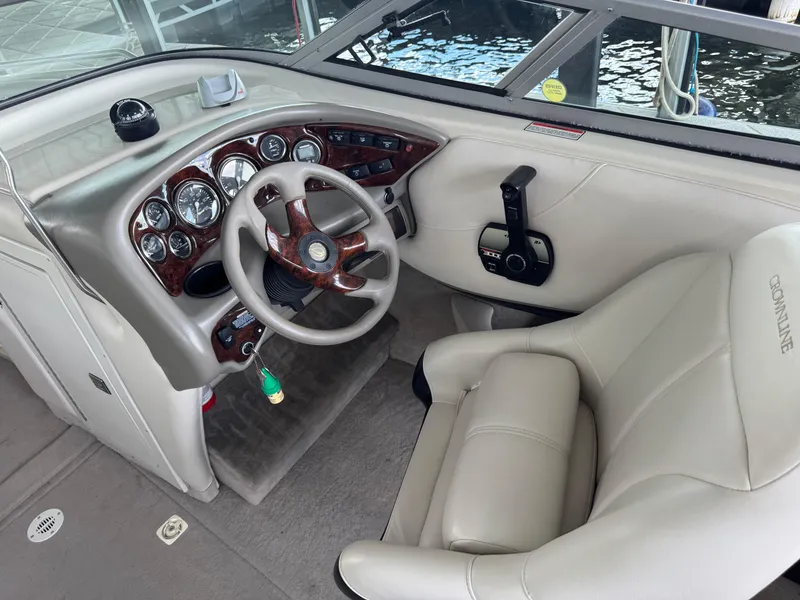 Slide: The Image of Interior of a 2000 Crownline 266 BR boat showing steering wheel and controls. - 3