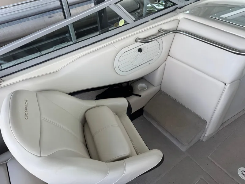 Slide: The Image of Interior of 2000 Crownline 266 BR boat with white seating and sleek design. - 4