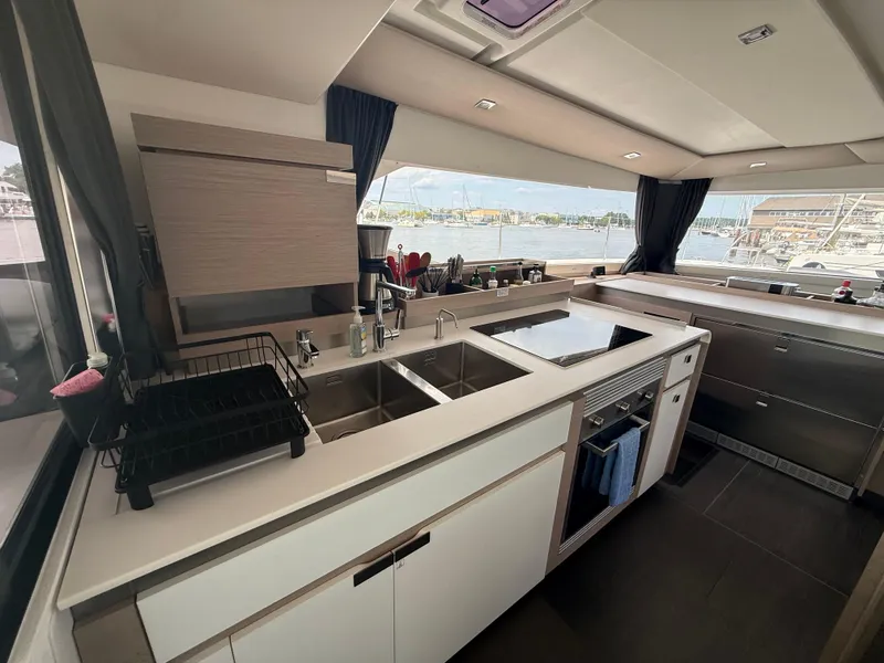 Slide: The Image of Modern kitchen interior of 2023 Fountaine Pajot Aura 51 yacht with sleek design and appliances. - 10