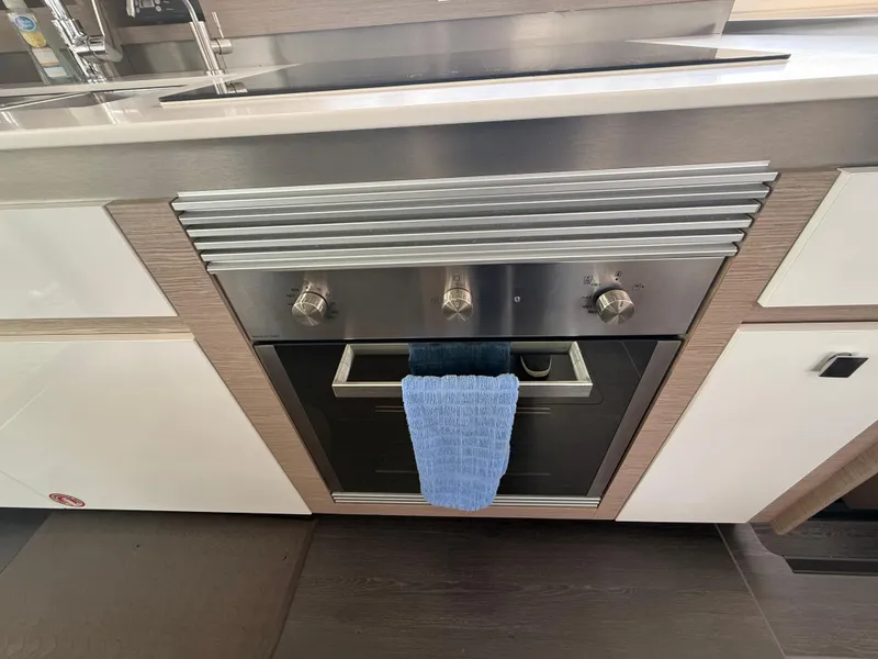 Slide: The Image of Modern kitchen oven in 2023 Fountaine Pajot Aura 51 yacht galley. - 12