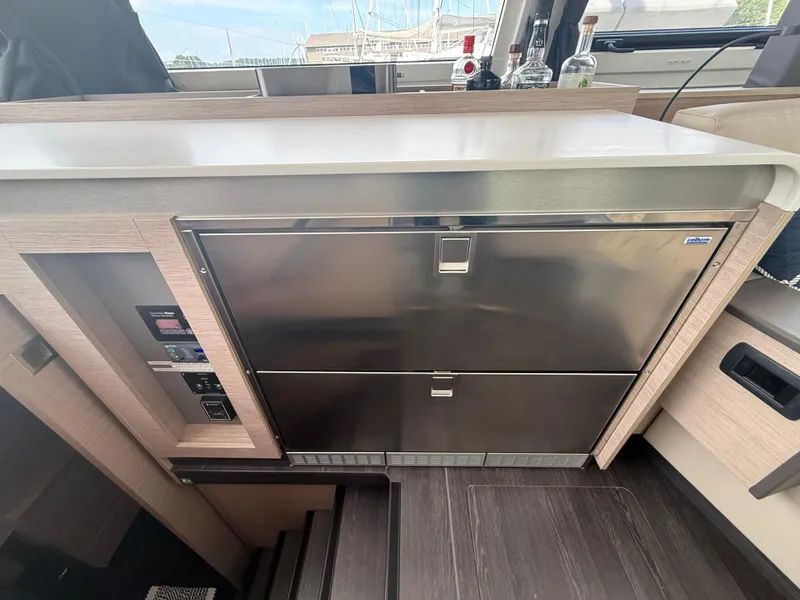 Slide: The Image of Modern kitchen area in 2023 Fountaine Pajot Aura 51 yacht with stainless steel appliances. - 13