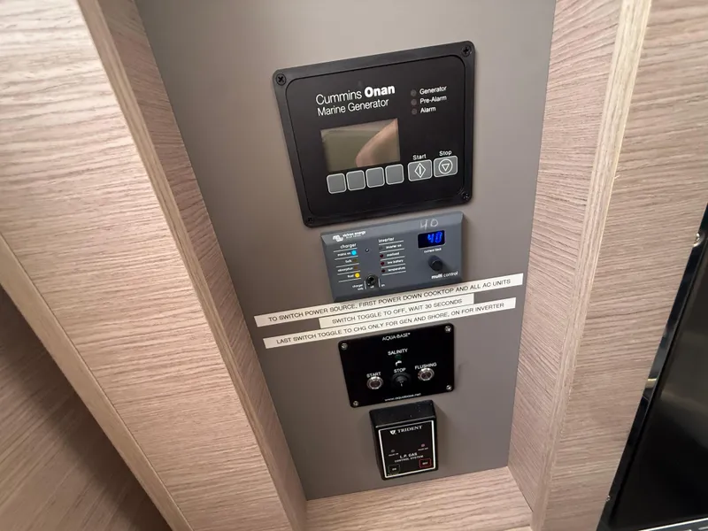 Slide: The Image of Control panel of 2023 Fountaine Pajot Aura 51 with Cummins Onan Marine Generator. - 14