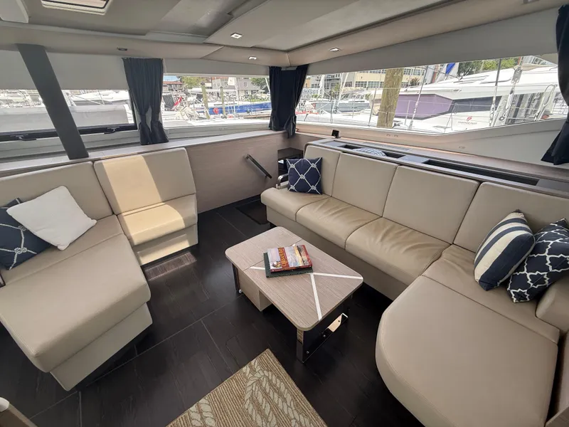 Slide: The Image of Luxurious interior of 2023 Fountaine Pajot Aura 51 yacht with elegant seating and decor. - 18
