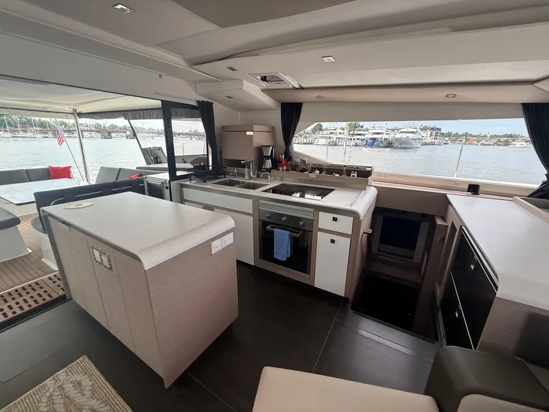 Slide: The Image of Luxurious interior of 2023 Fountaine Pajot Aura 51 yacht with modern kitchen and scenic views. - 19
