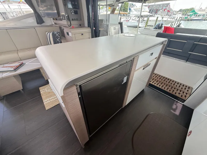Slide: The Image of Interior of 2023 Fountaine Pajot Aura 51 yacht with modern kitchen and seating area. - 21