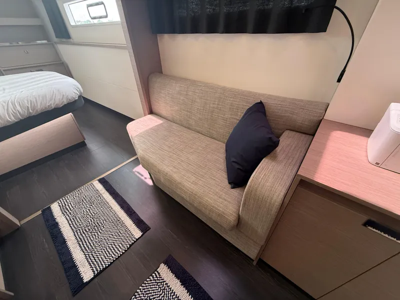 Slide: The Image of 2023 Fountaine Pajot Aura 51 interior with sofa, bed, and modern decor. - 25