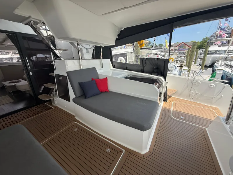 Slide: The Image of 2023 Fountaine Pajot Aura 51 yacht interior with sleek seating and modern design. - 3