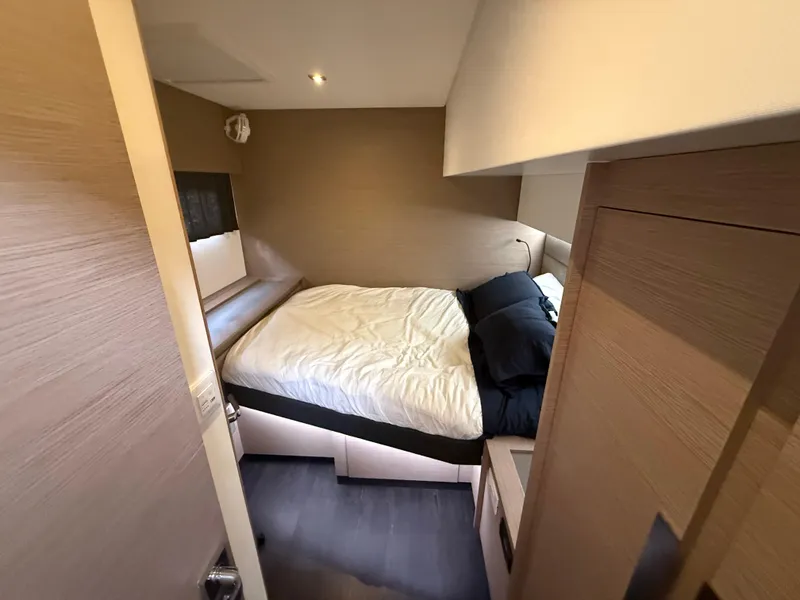 Slide: The Image of Cozy bedroom in 2023 Fountaine Pajot Aura 51 yacht, featuring modern design and comfortable bedding. - 38