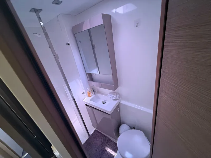 Slide: The Image of Modern bathroom in 2023 Fountaine Pajot Aura 51 yacht, featuring sleek design and compact amenities. - 40