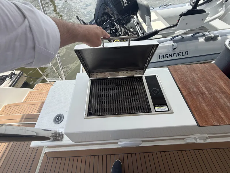 Slide: The Image of Outdoor grill on 2023 Fountaine Pajot Aura 51 yacht deck, near water and boat equipment. - 41