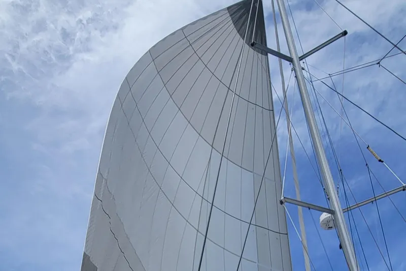 Slide: The Image of Sail of 2023 Fountaine Pajot Aura 51 catamaran against a blue sky. - 46