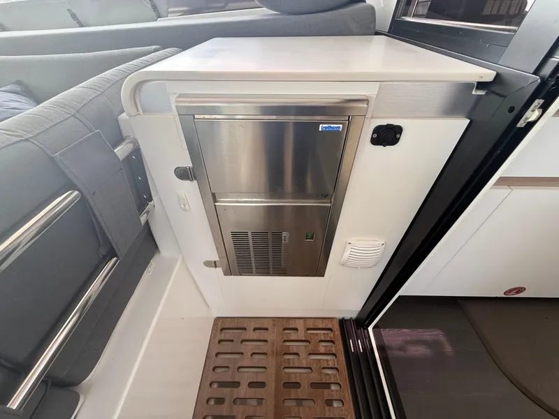 Slide: The Image of Interior of 2023 Fountaine Pajot Aura 51 yacht, featuring a compact stainless steel appliance. - 7